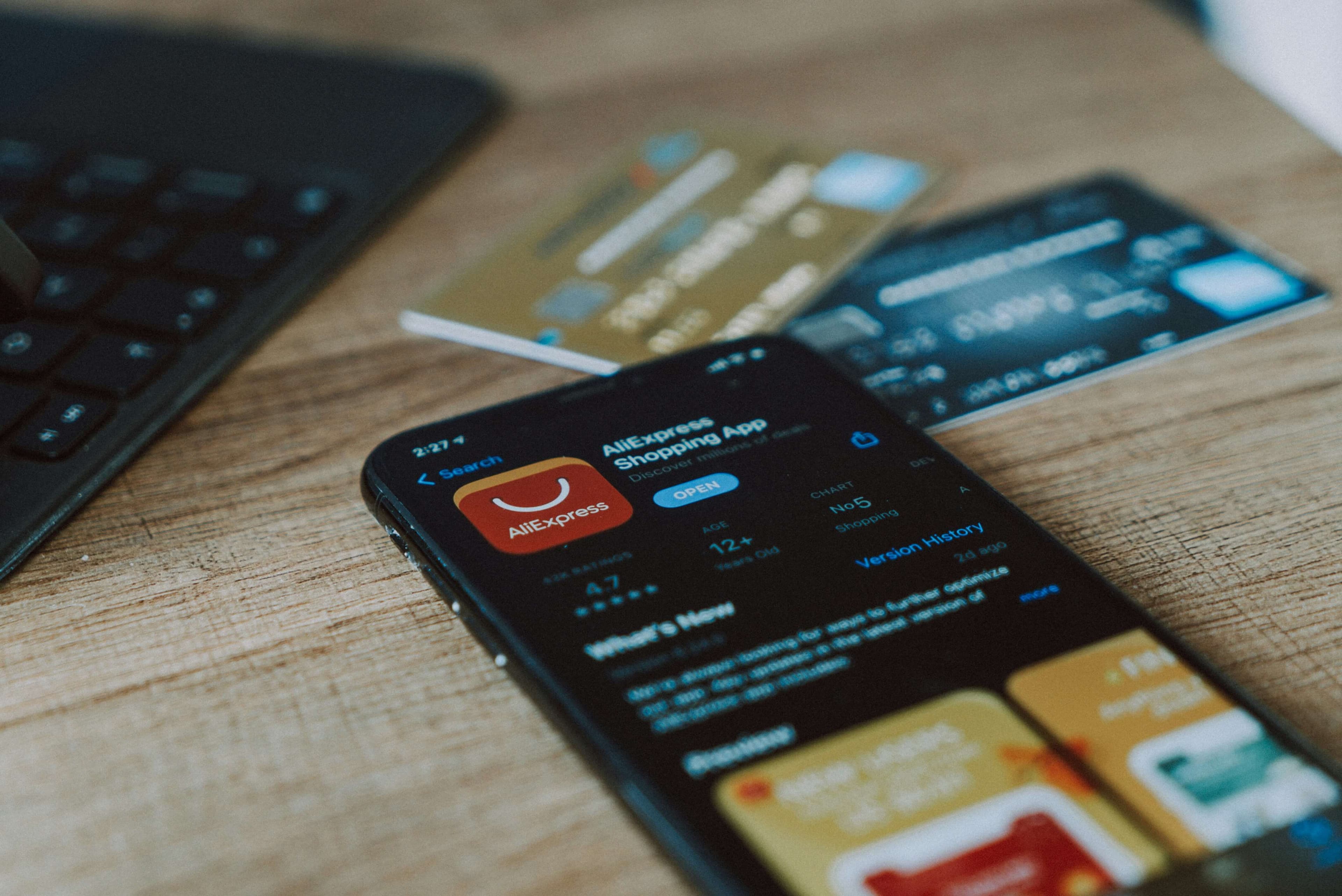 An American Express card held in front of a summer travel destination background.