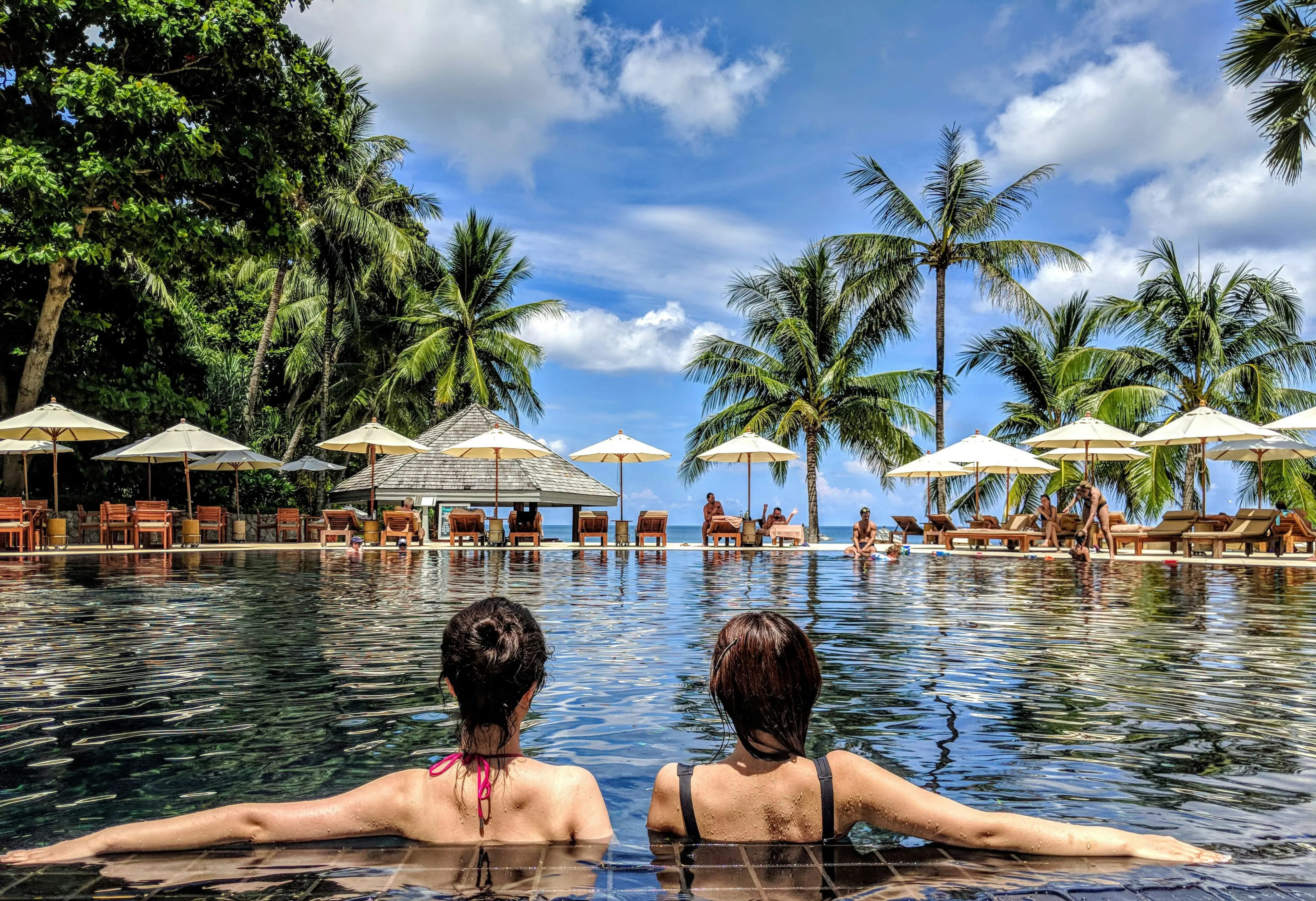 American Express and Chase credit cards with a travel destination background