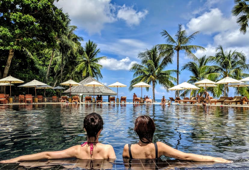 American Express and Chase credit cards with a travel destination background